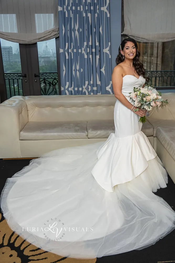 Bride in her gown in a hotel suite