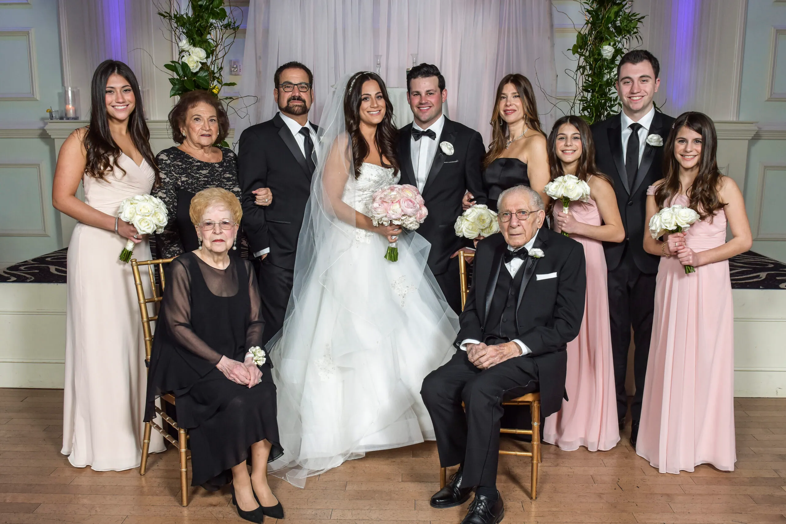 Formal wedding portrait with three generations
