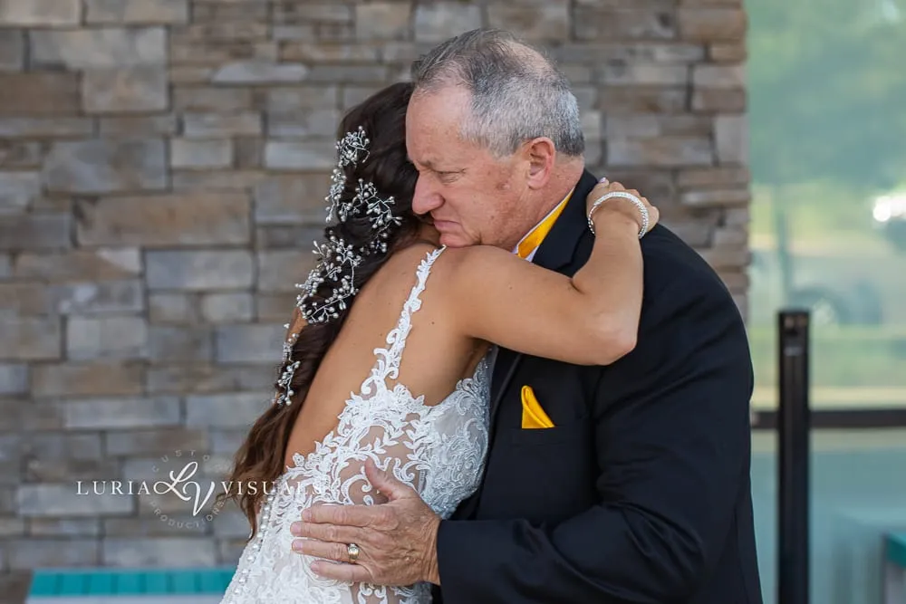 Father embracing the bride