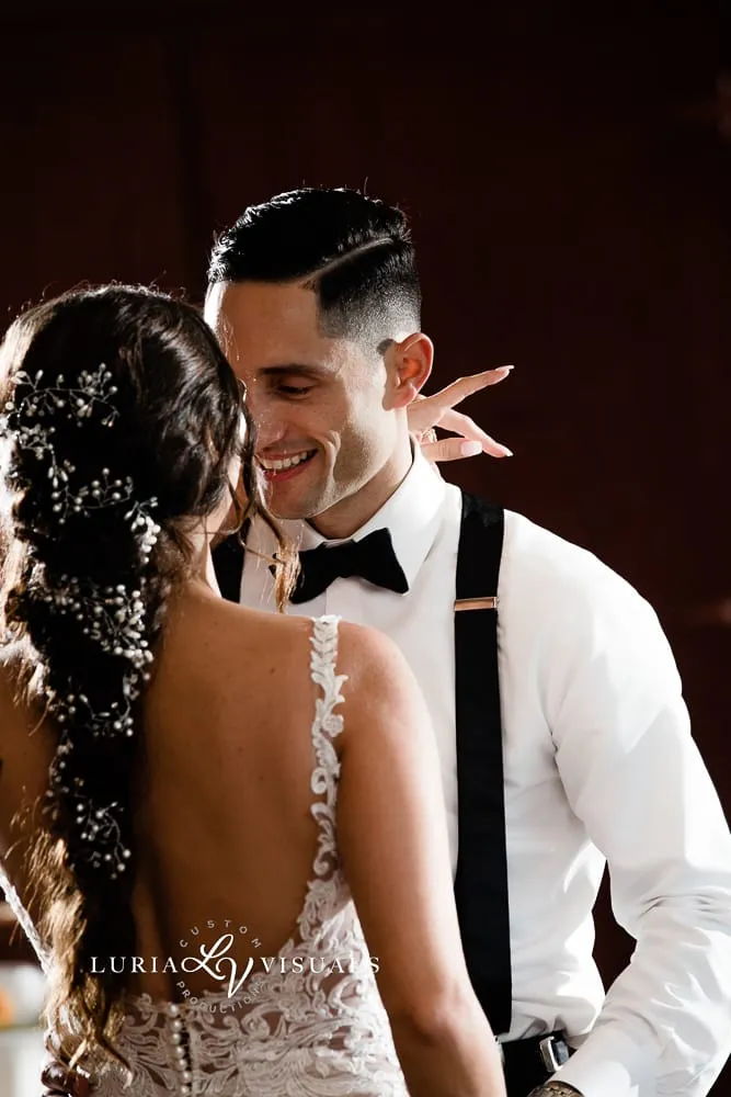 Bride and groom laughing during their first dance