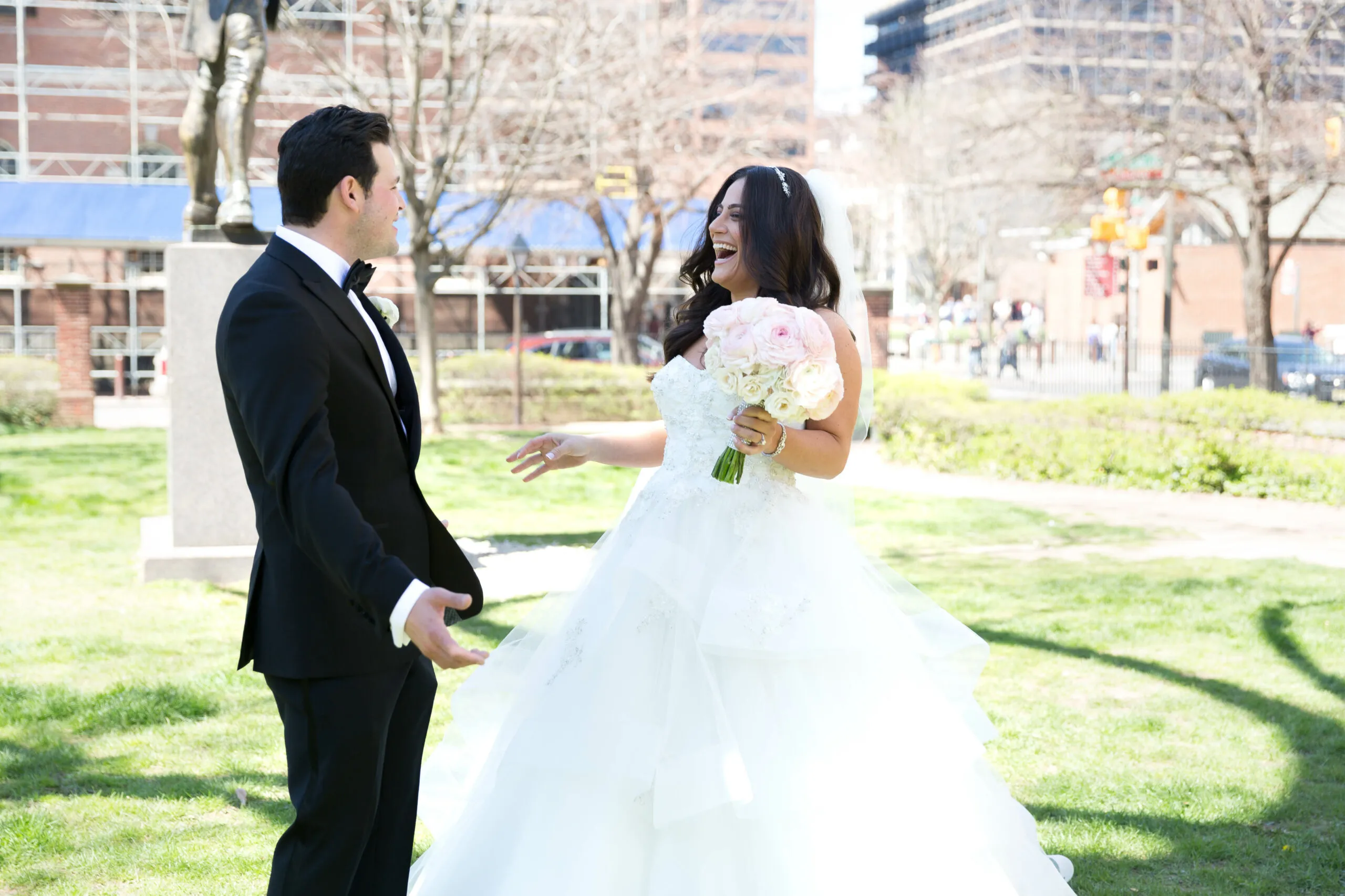 Bride and groom first look in a city park